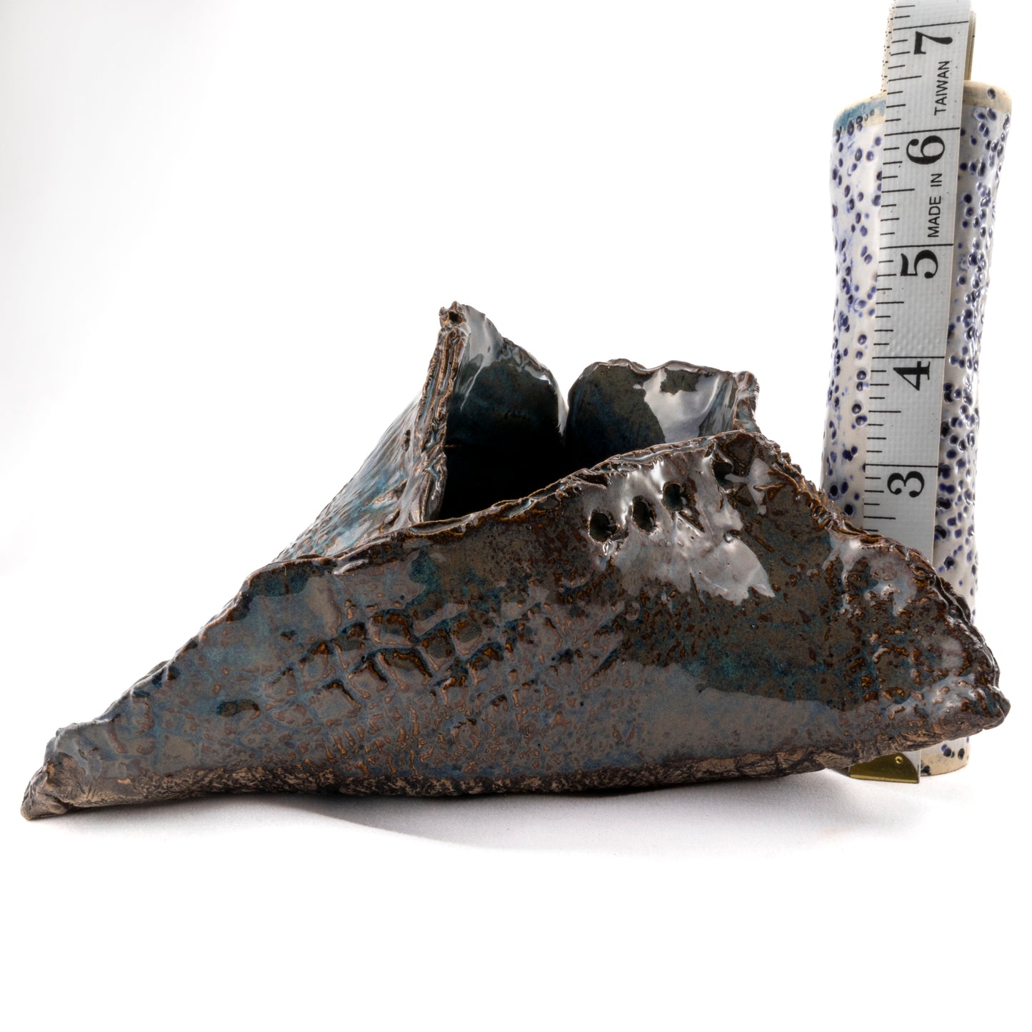 A Fox's Den Ceramic Triangular Sculpture