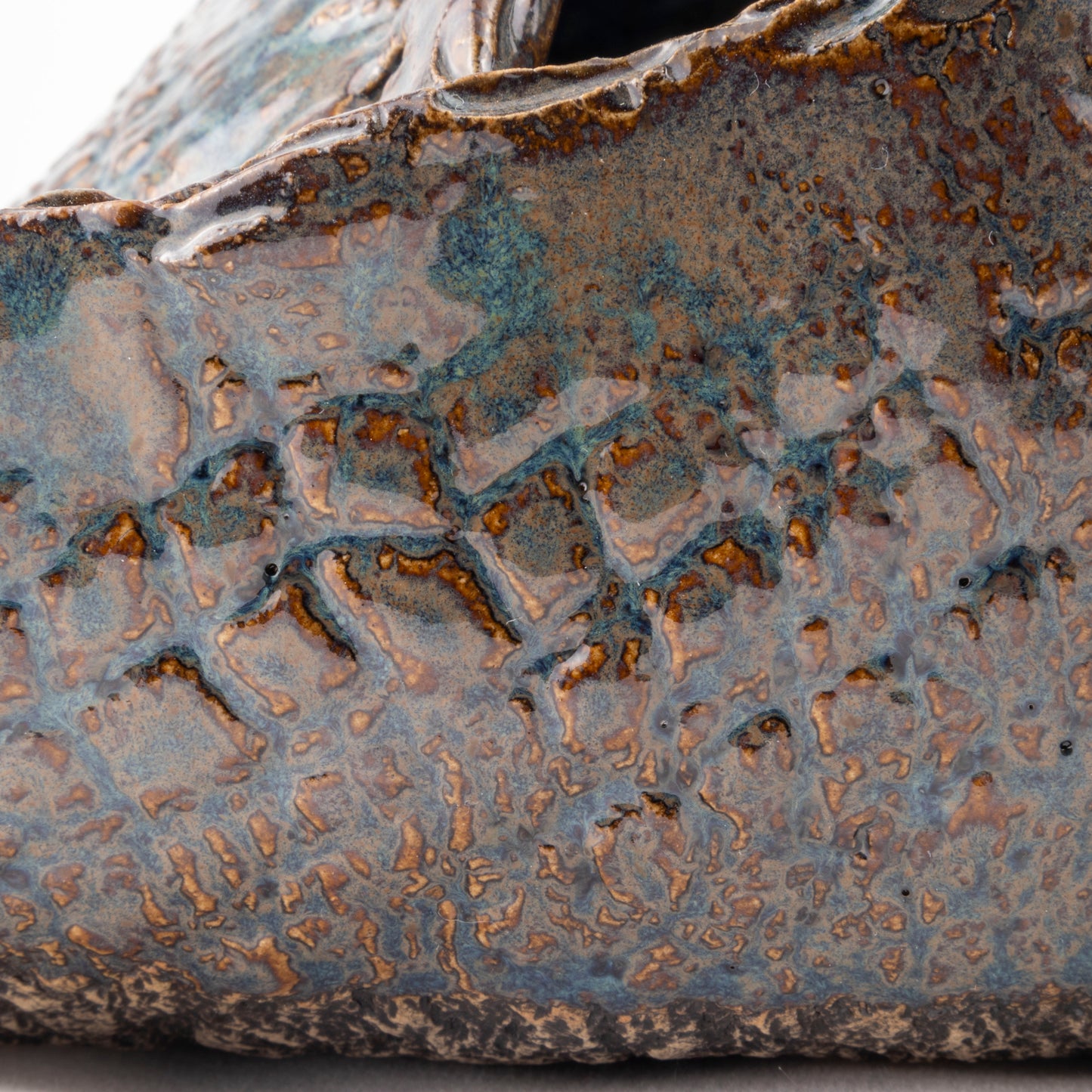 A Fox's Den Ceramic Triangular Sculpture